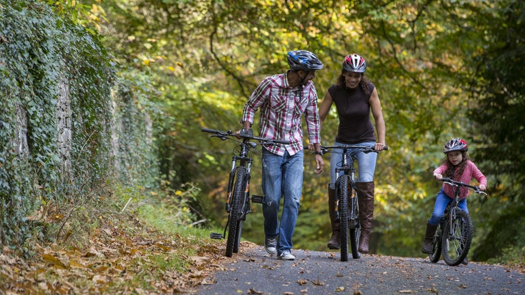 Family Walking with bikes